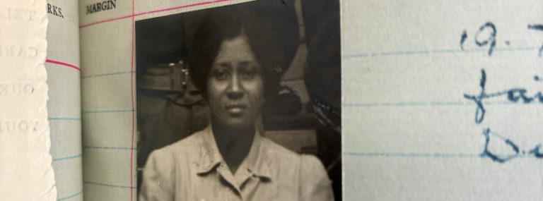 A cropped view of a black and white portrait photograph of a women pasted onto a lined notebook page.